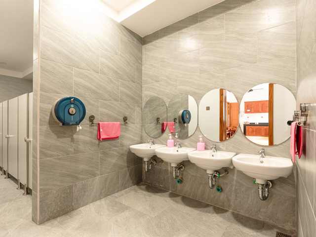 A washroom at Orange Crest Preschool with basins set at child height