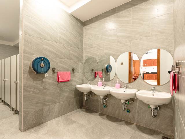 A washroom at Orange Crest Preschool with basins set at child height