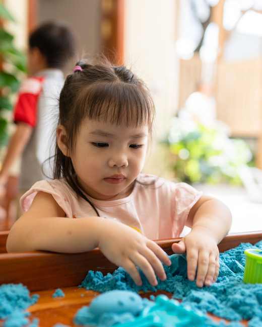 A child at work in the Panda Class at Orange Crest Preschool