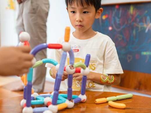 A child at work in the Giraffe Class at Orange Crest Preschool