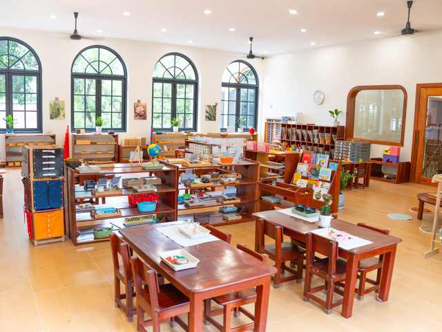 Montessori materials set out on open timber shelves in a classroom at Orange Crest Preschool