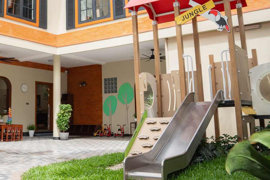 The playhouse, climbing frame and slide in the renovated courtyard of Orange Crest Preschool