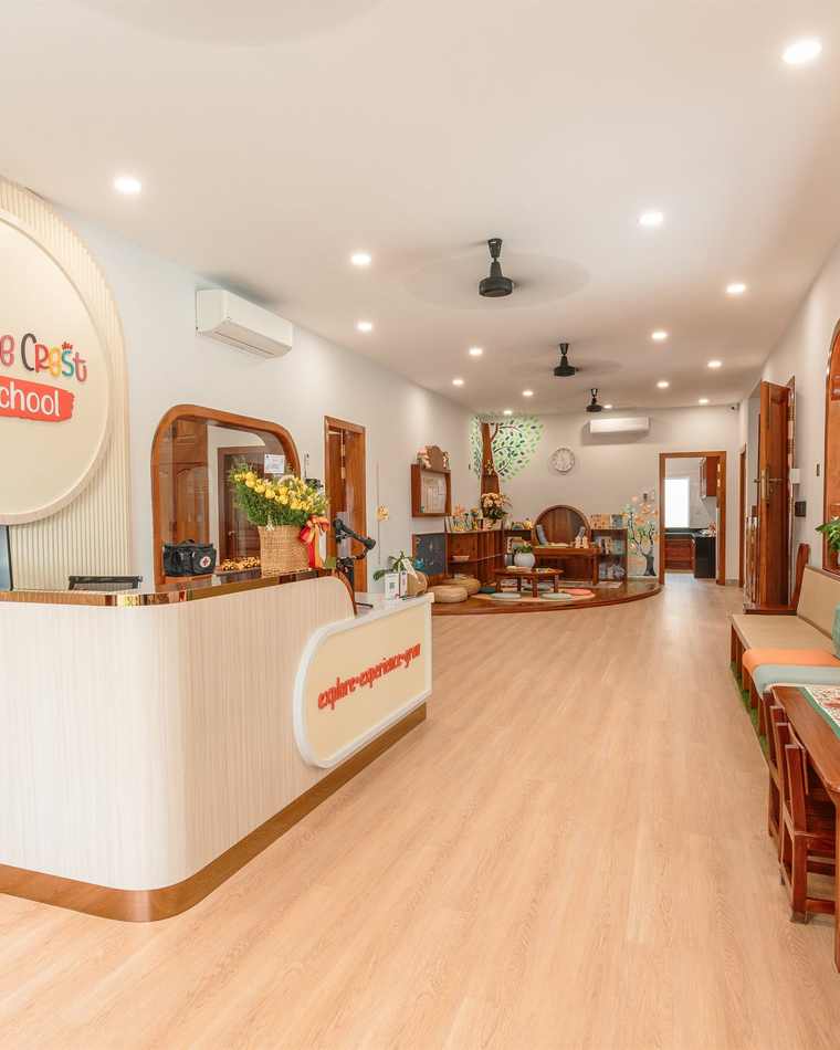 The reception lobby at Orange Crest Preschool, with warm timber and soft seating