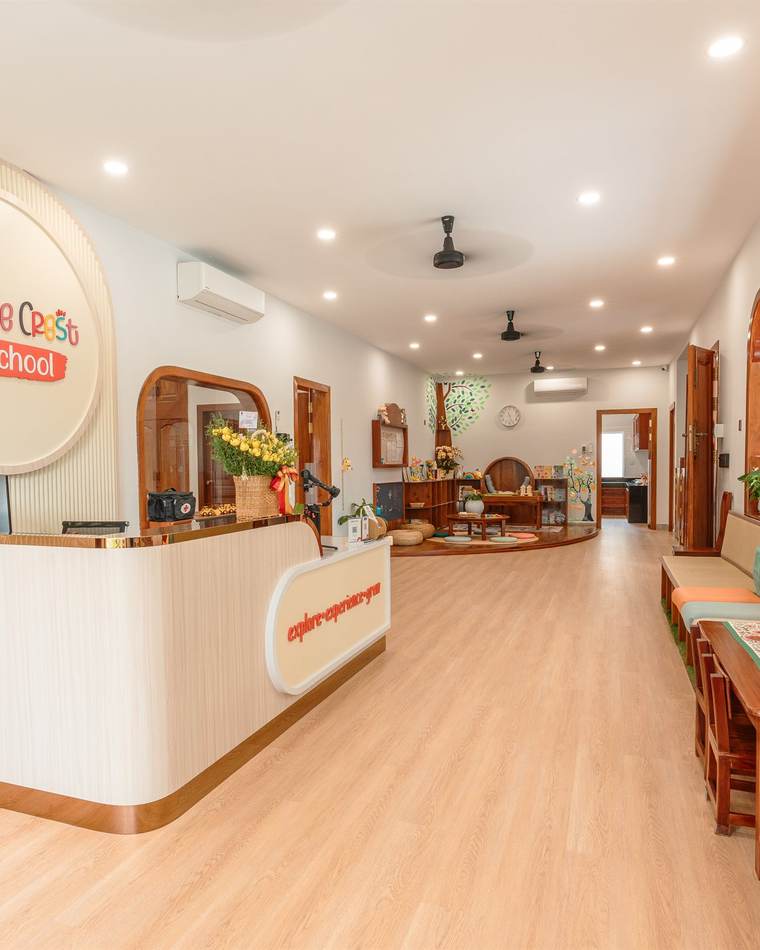 The reception lobby at Orange Crest Preschool, with warm timber and soft seating
